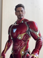 Close-up of a detailed superhero action figure posed dynamically on a sleek shelf.