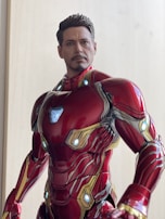 A McFarlane figure with intricate armor details illuminated by soft lighting.