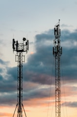 a couple of cell towers sitting next to each other