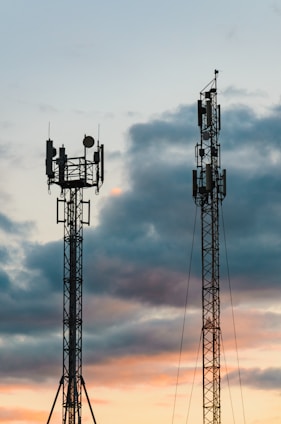 a couple of cell towers sitting next to each other
