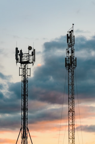 a couple of cell towers sitting next to each other