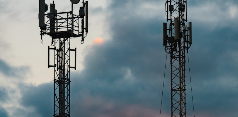 a couple of cell towers sitting next to each other