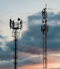 a couple of cell towers sitting next to each other