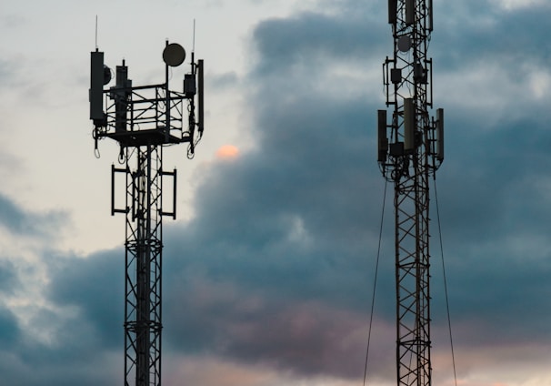 a couple of cell towers sitting next to each other