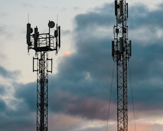 a couple of cell towers sitting next to each other