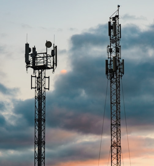 a couple of cell towers sitting next to each other