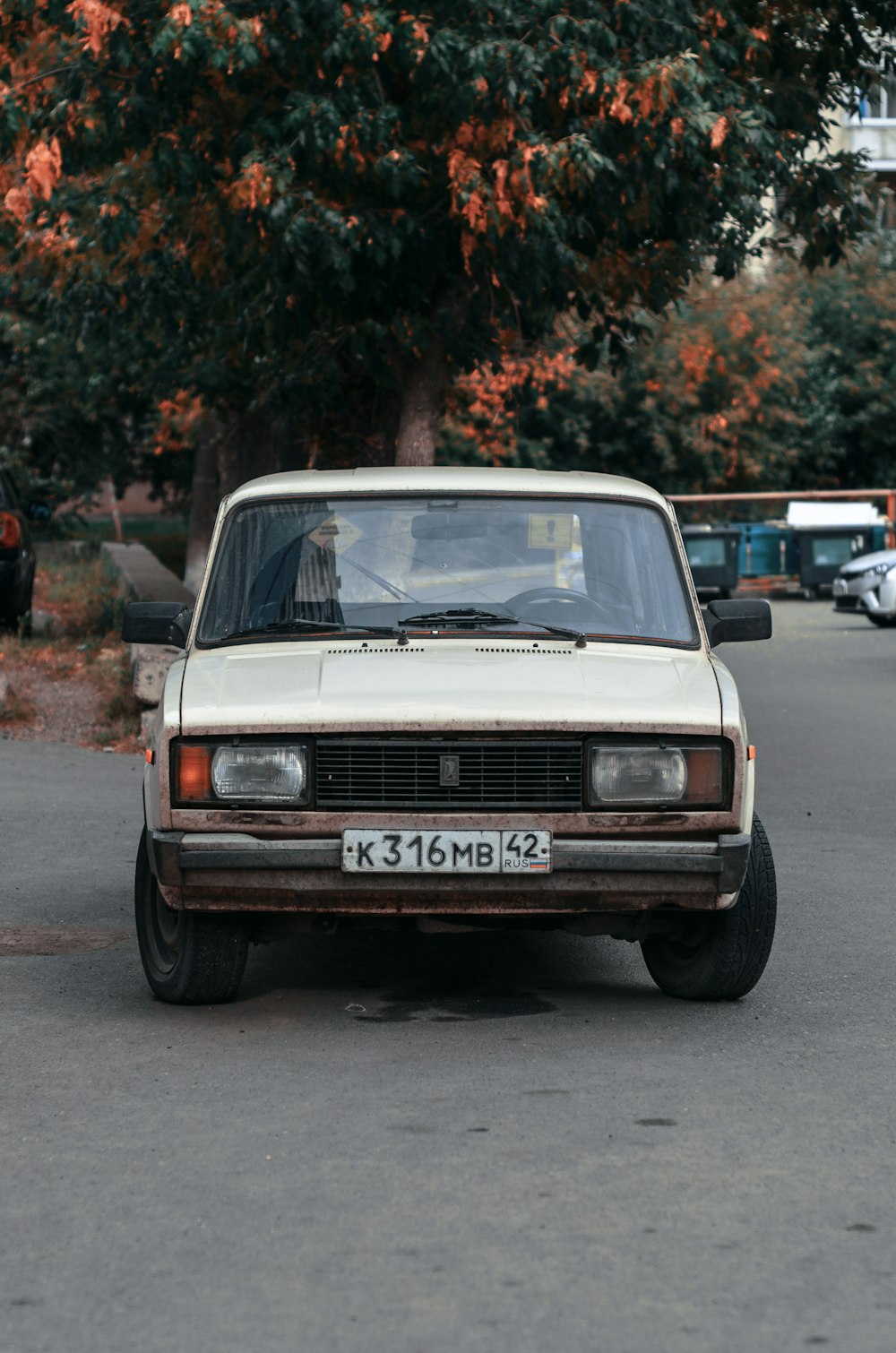 an old car parked on the side of the road