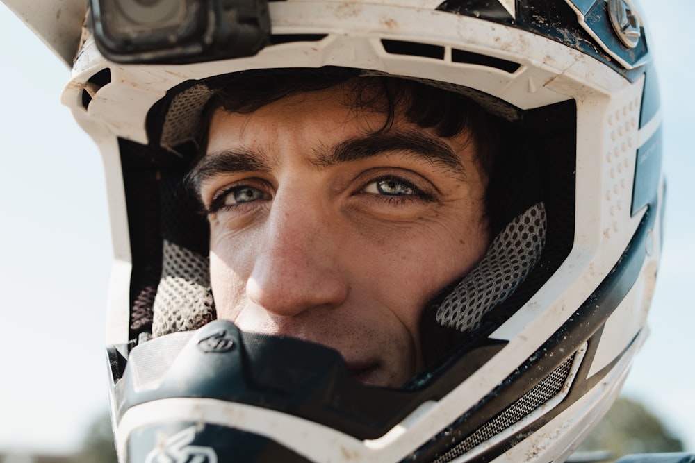 a close up of a person wearing a motorcycle helmet