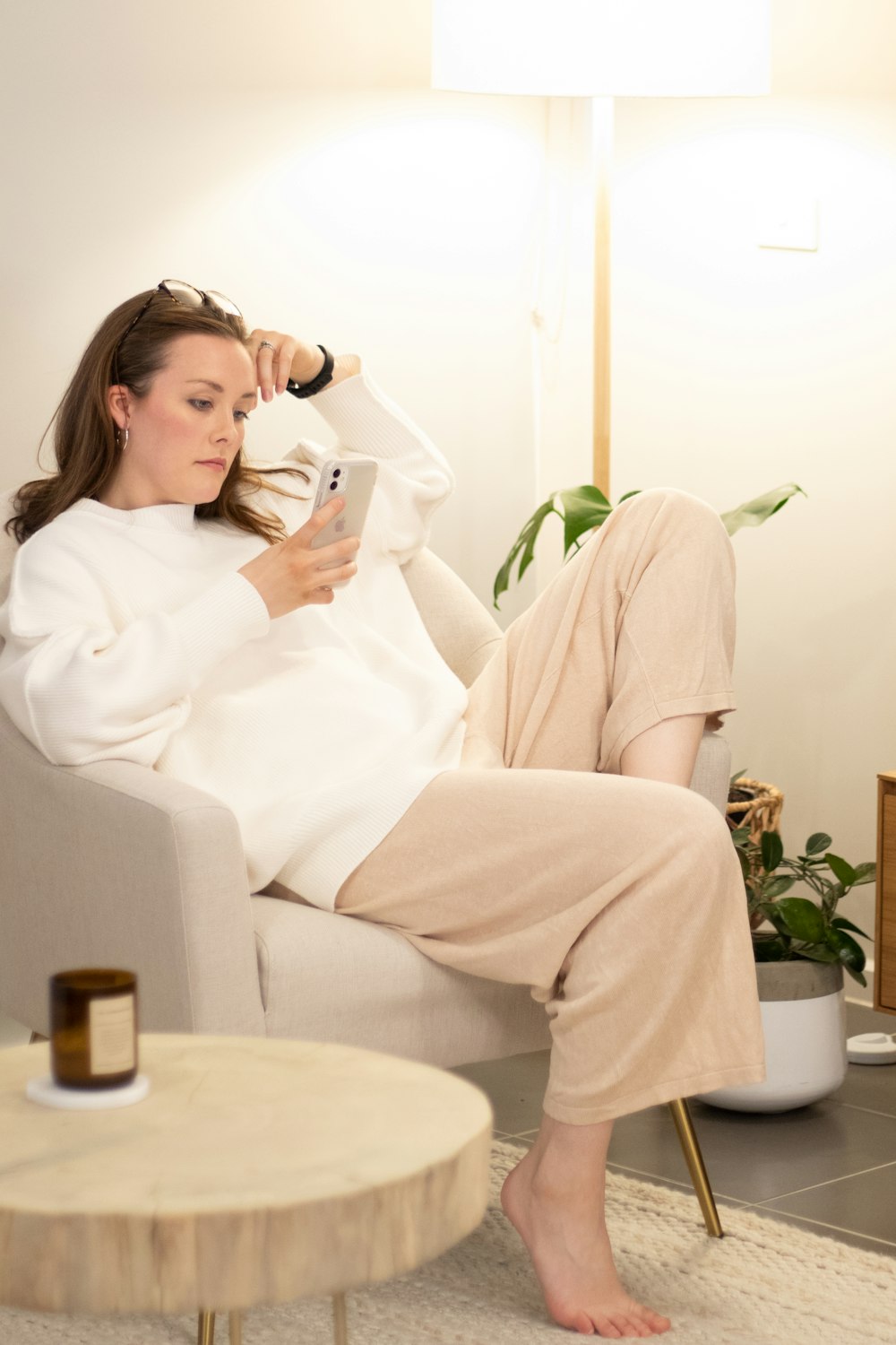 a woman sitting on a couch in a living room