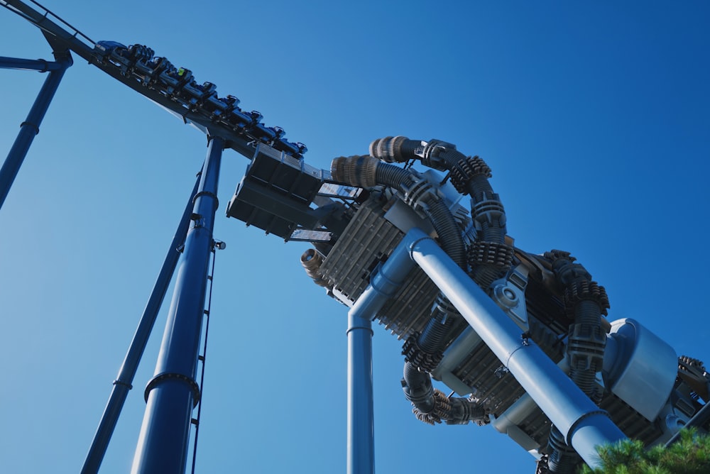 a roller coaster with a blue sky in the background