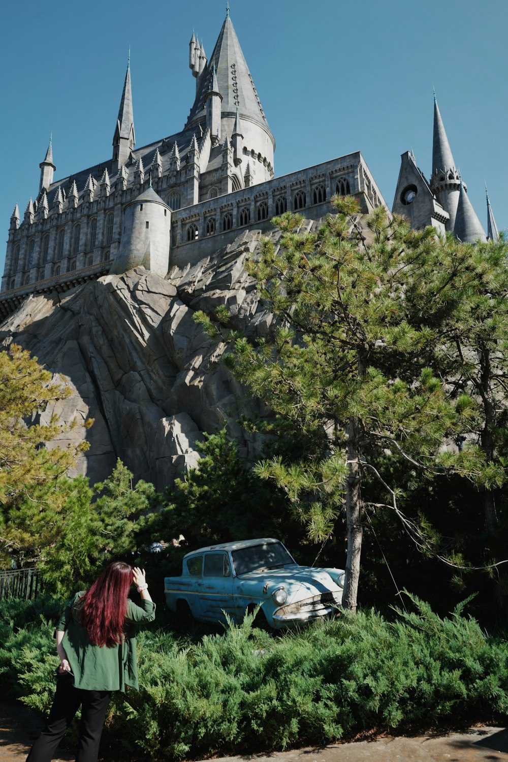 a car parked in front of a castle