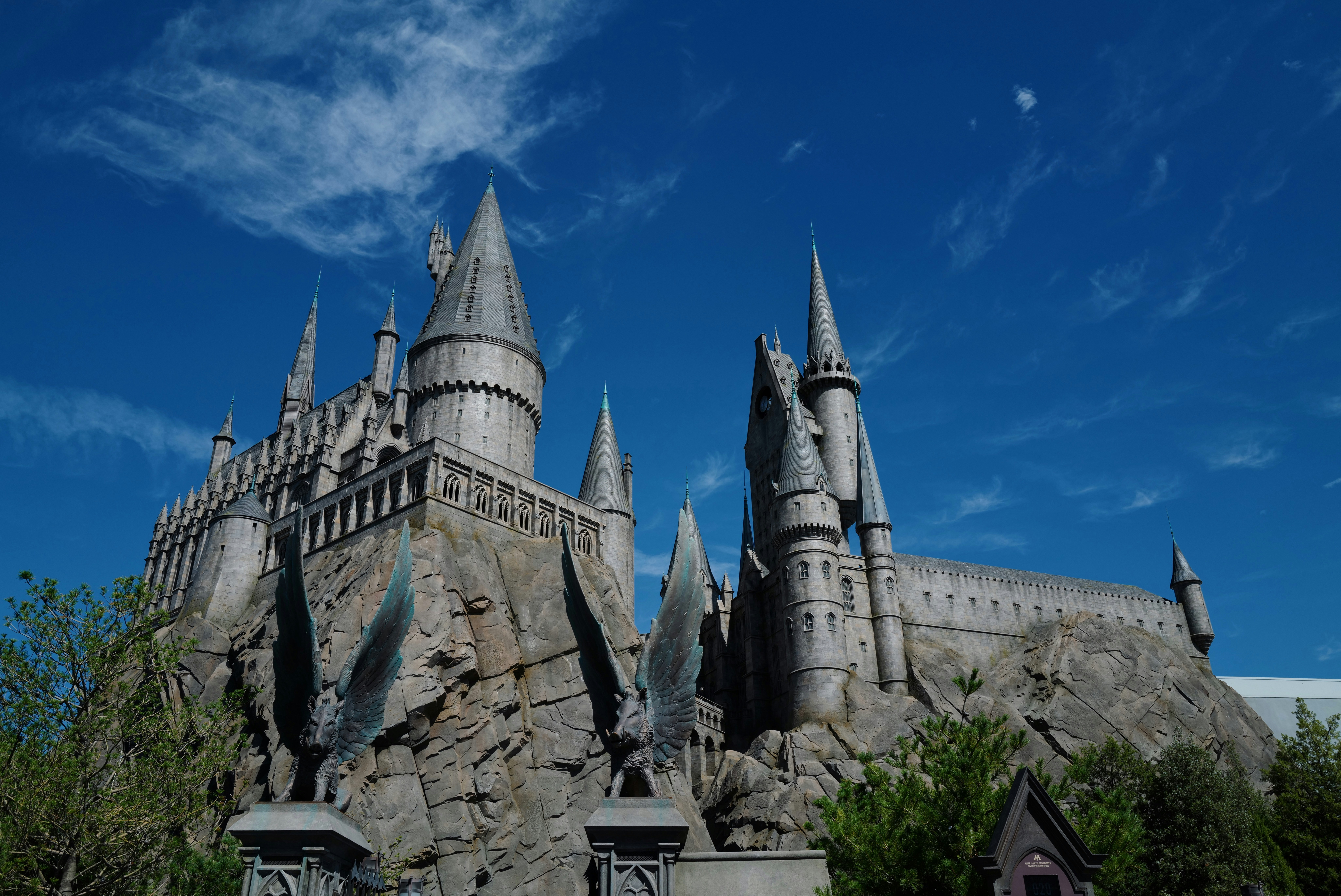 a castle made out of rocks with a blue sky in the background