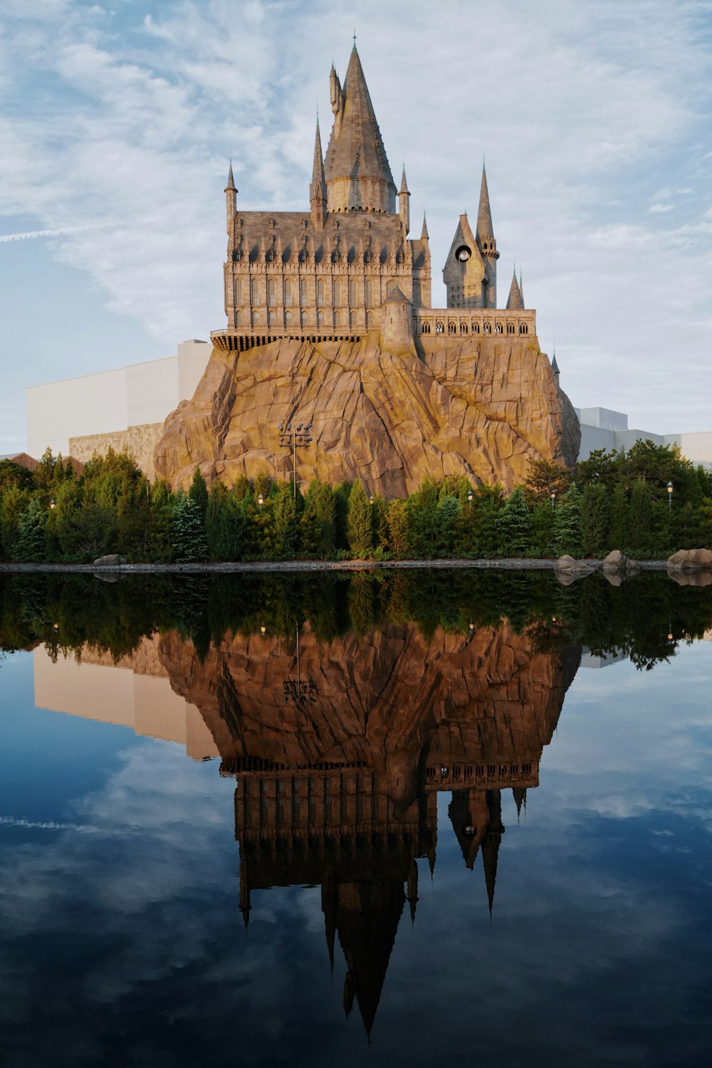 a castle with a reflection in the water