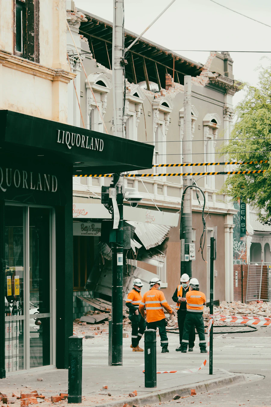 A group of people standing amid disaster wreckage