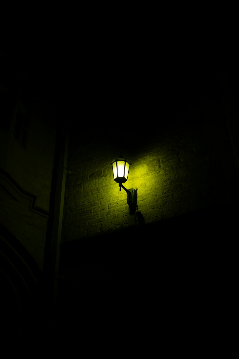 a street light is lit up in the dark