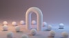 a group of white balls sitting next to a white arch