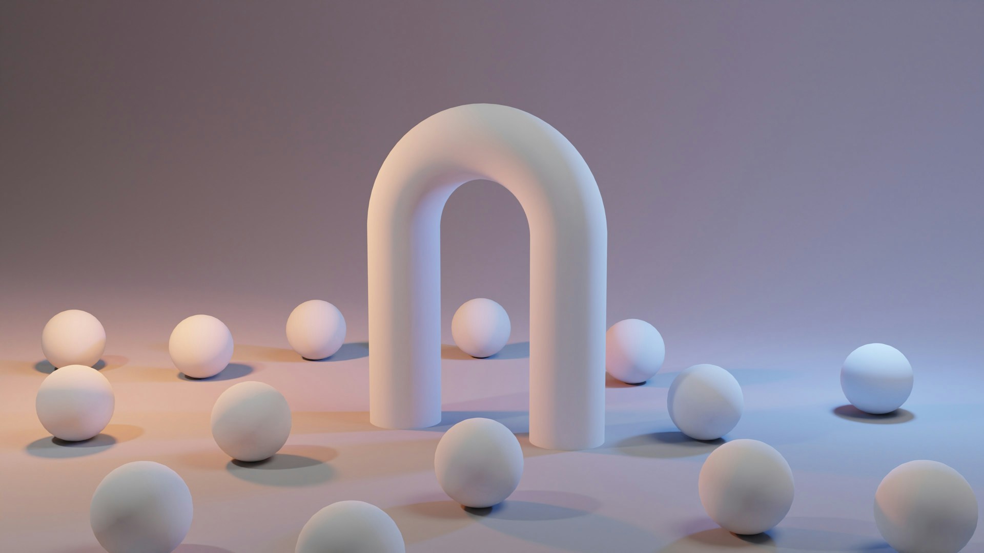 a group of white balls sitting next to a white arch