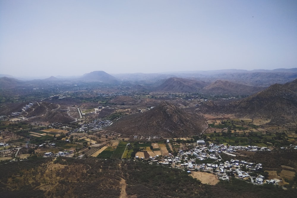 an aerial view of a small town in the mountains