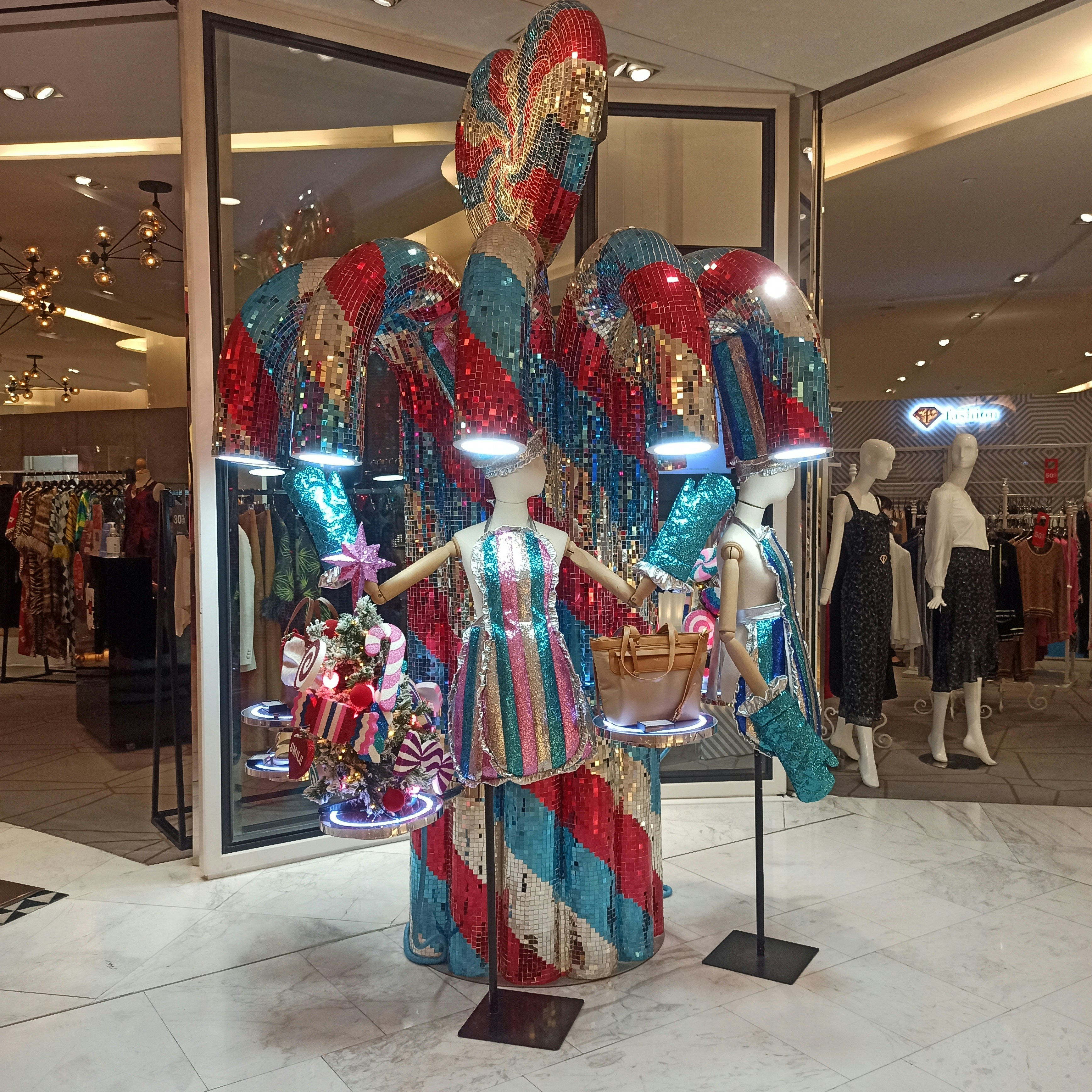 Sparkling sequin party dress on a mannequin, warm studio lighting, glamorous boutique display