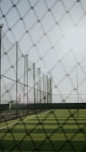 a view of a baseball field through a fence