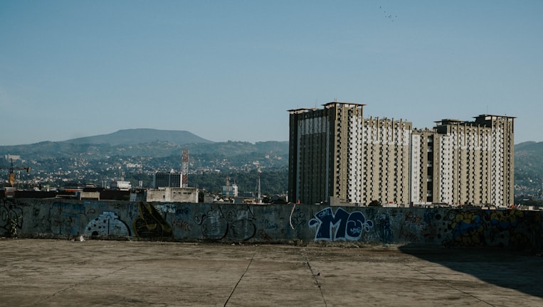 Architectural blueprint overlay on a completed urban housing project