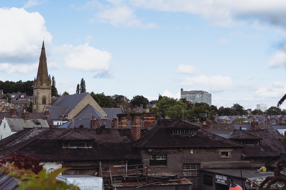 a city skyline with a church steeple in the background