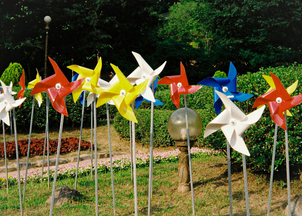 a bunch of pinwheels that are in the grass