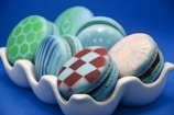 A close-up of colorful macarons on a decorative table.