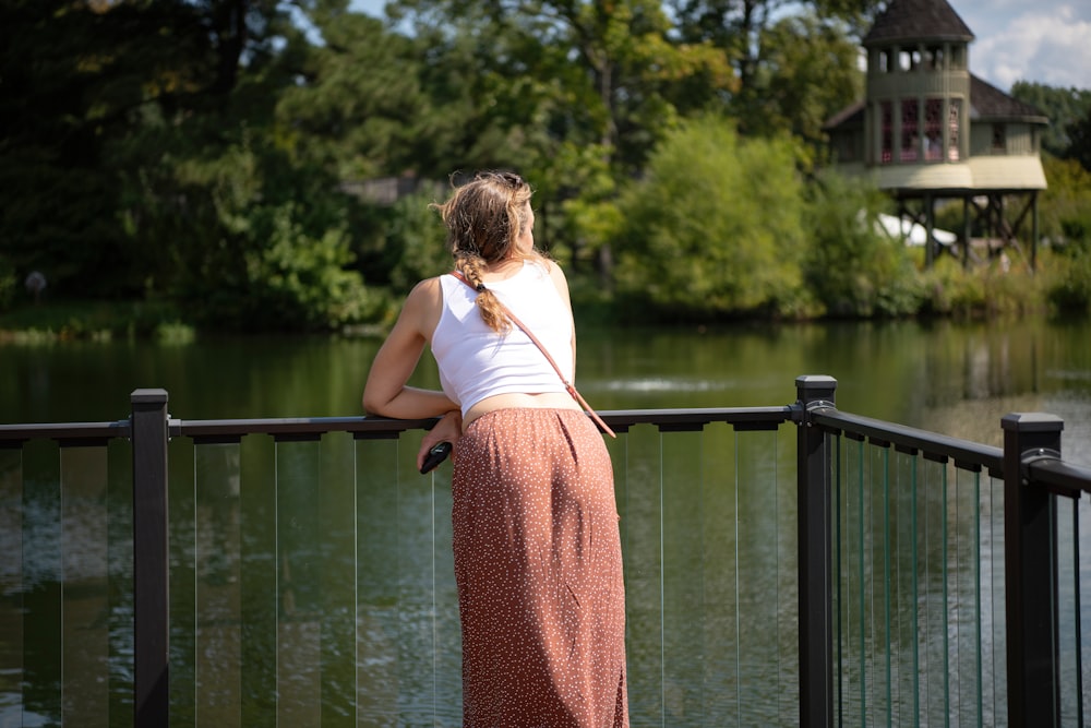 a person standing in front of a body of water