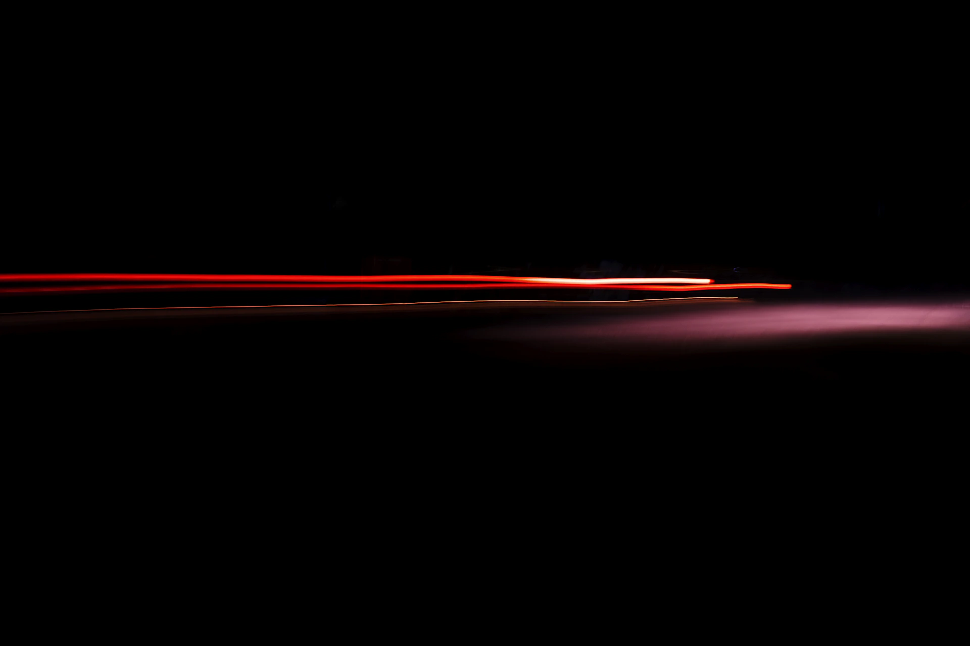 a blurry photo of a red light in the dark