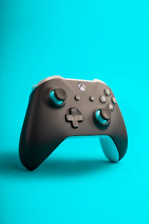 a close up of a controller on a blue background