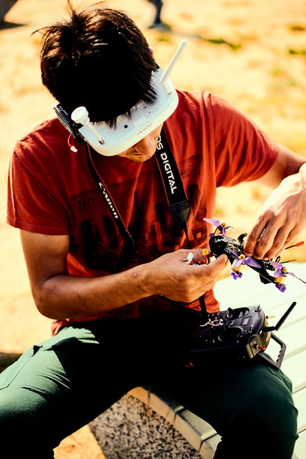 A friendly customer service representative wearing a headset, ready to assist with drone and thermal camera inquiries.