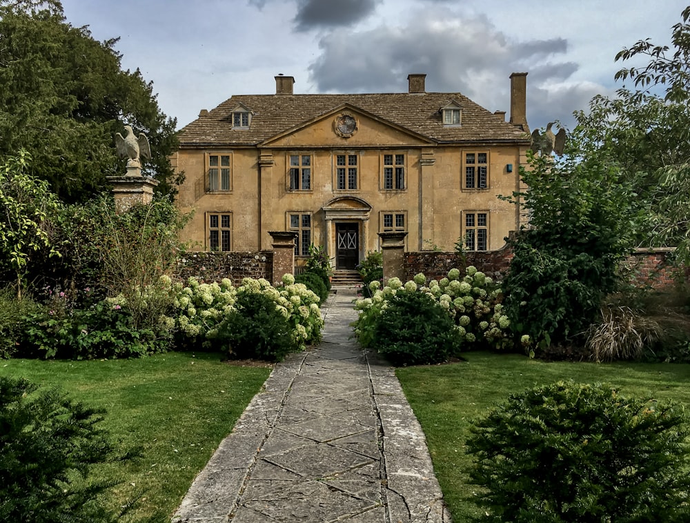 a large house with a walkway leading to it