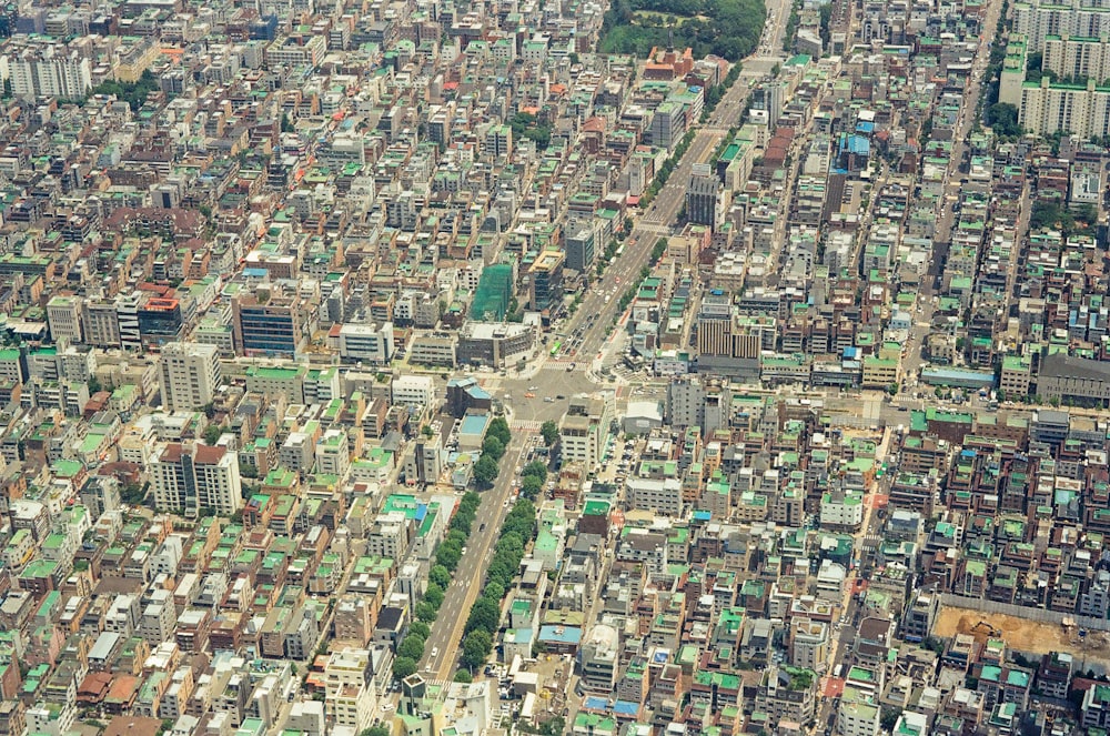 an aerial view of a city with lots of tall buildings