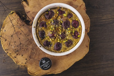 Edible cannabis treats arranged on a rustic plate with natural lighting.