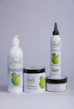 A set of four hair care products with white packaging, each featuring the word 'Amla' and an image of green fruit. The products include a herbal conditioning shampoo, herbal hair treatment, herbal hair oil, and herbal hair food.