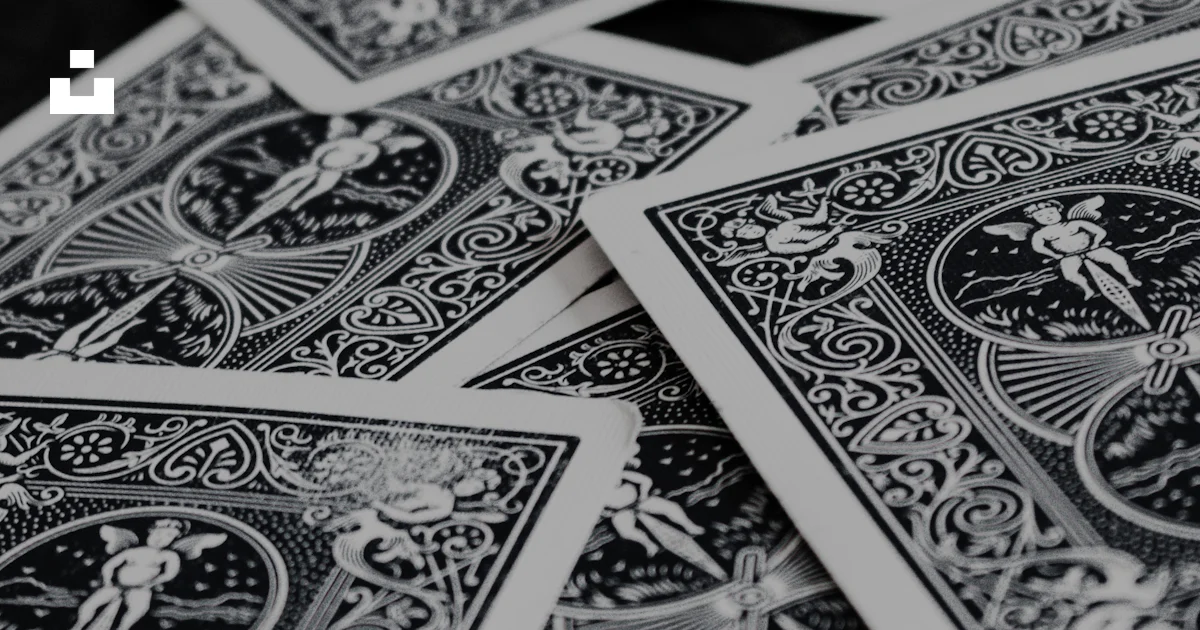 Cards Pile Pattern A pile of playing cards sitting on top of a table photo – Free Grey ...