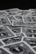 a pile of playing cards sitting on top of a table