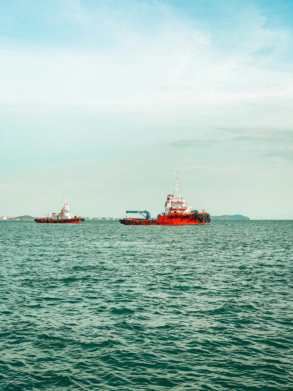 two ships in the water near each other