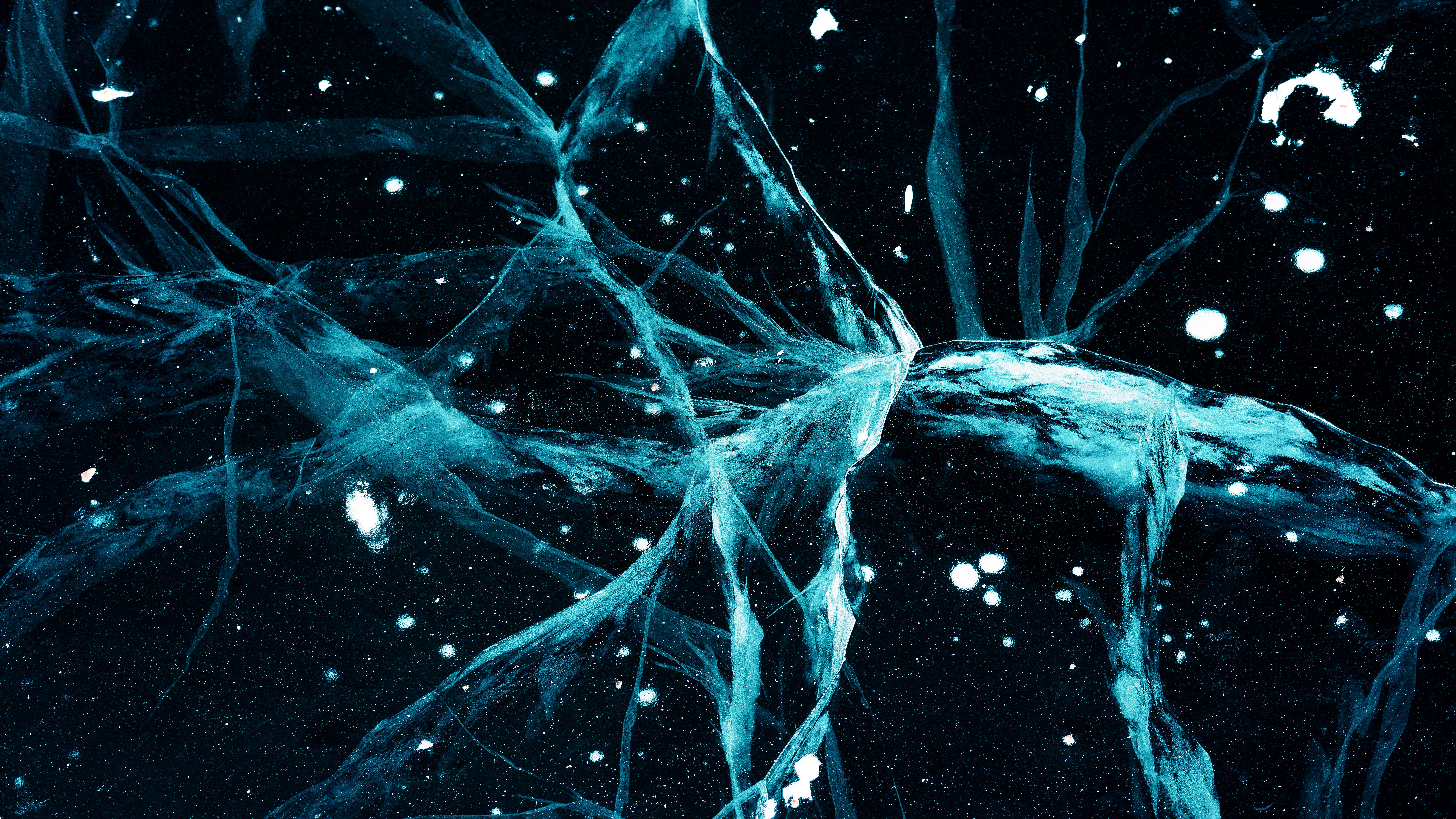 a bunch of blue ice on a black background