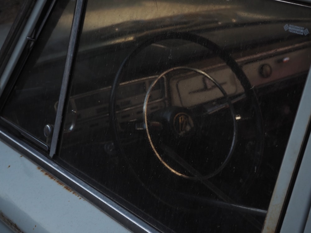 the interior of a car with a steering wheel