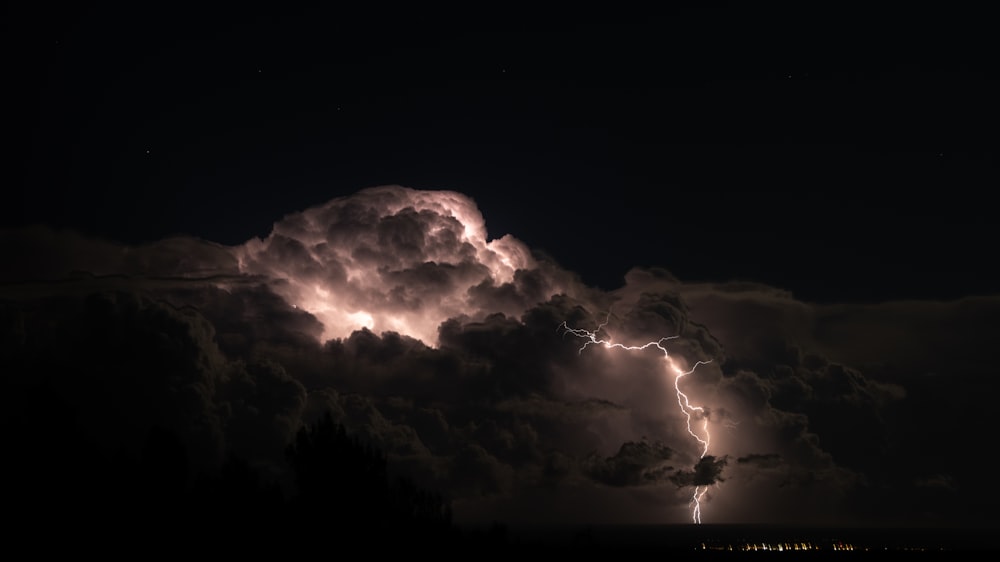 a large cloud with a lightning bolt coming out of it