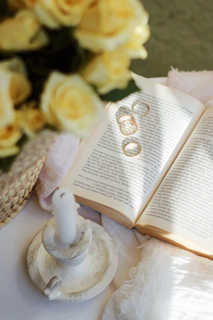 Sunlight filtering through trees onto a handwritten vow book resting on a vintage table.