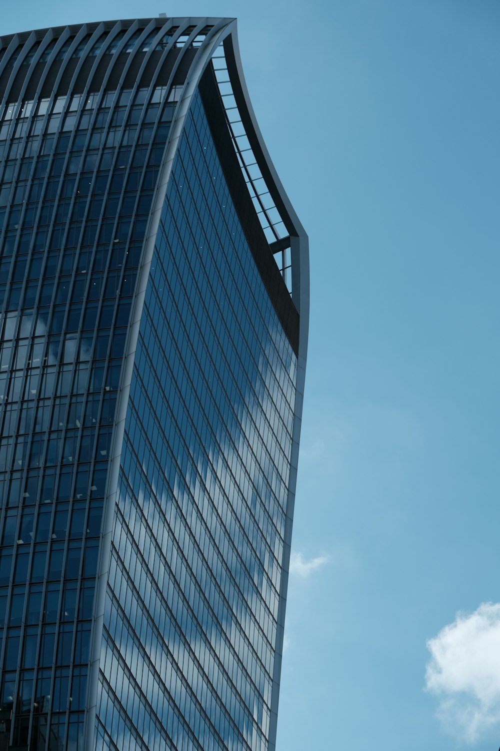 a very tall building with a sky background