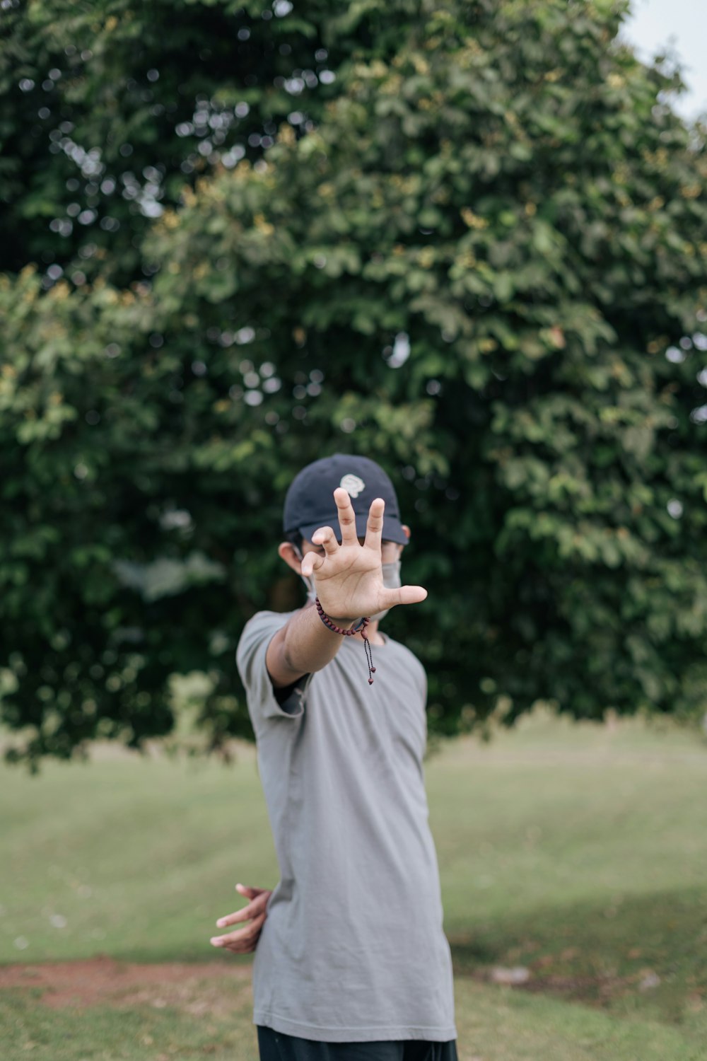 a man holding his hands up in the air