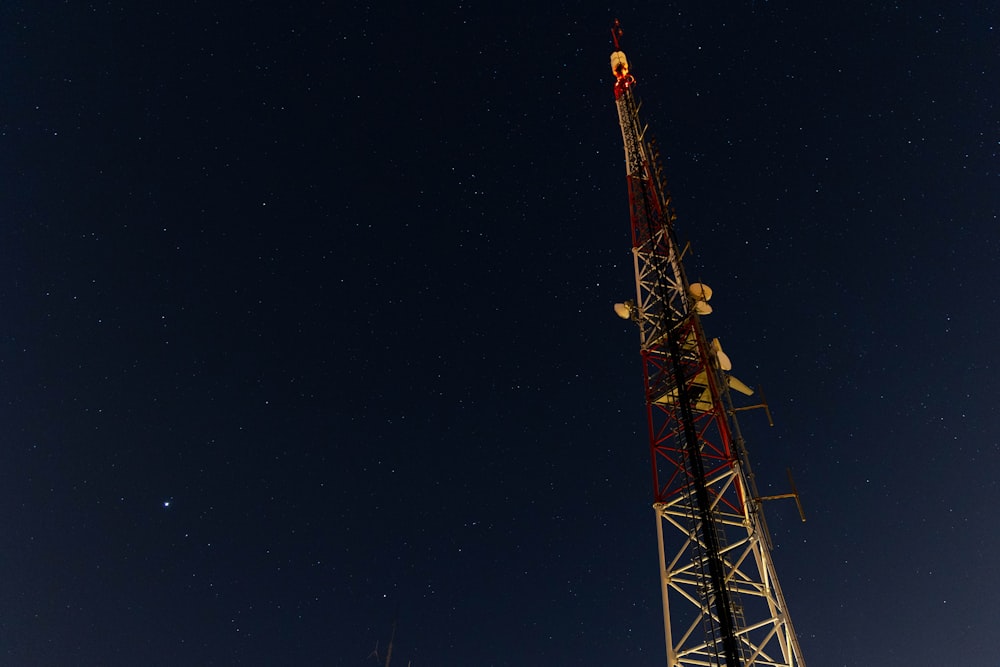 a very tall tower sitting under a night sky