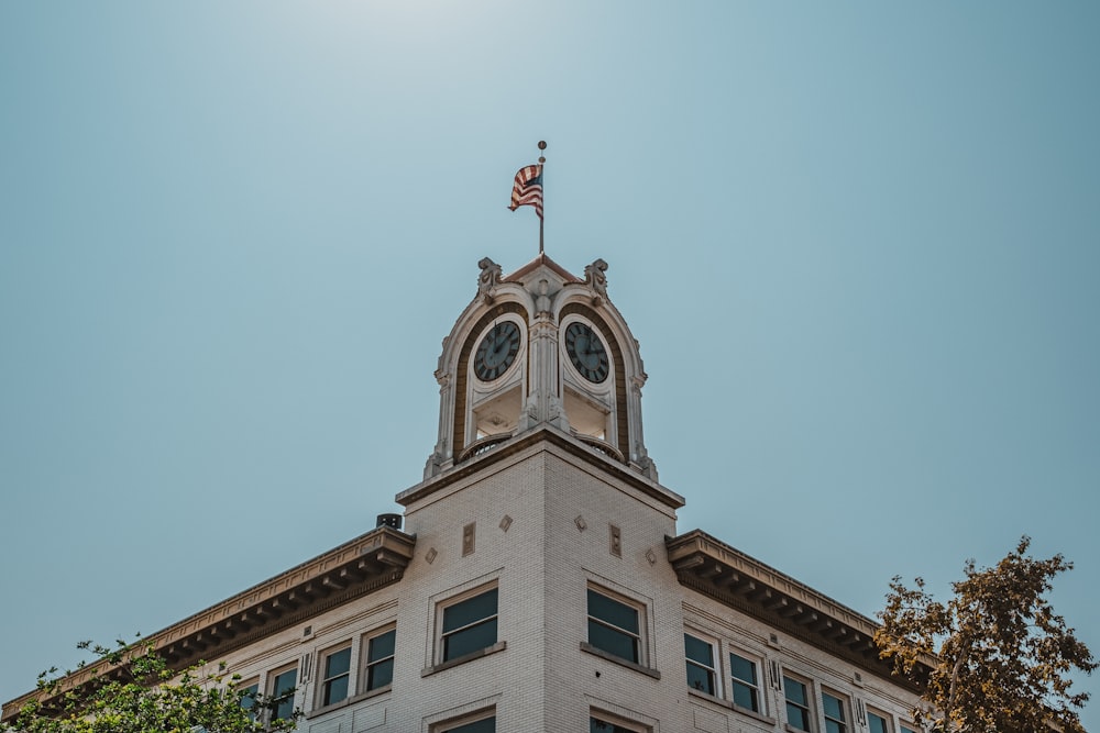 a tall building with a flag on top of it