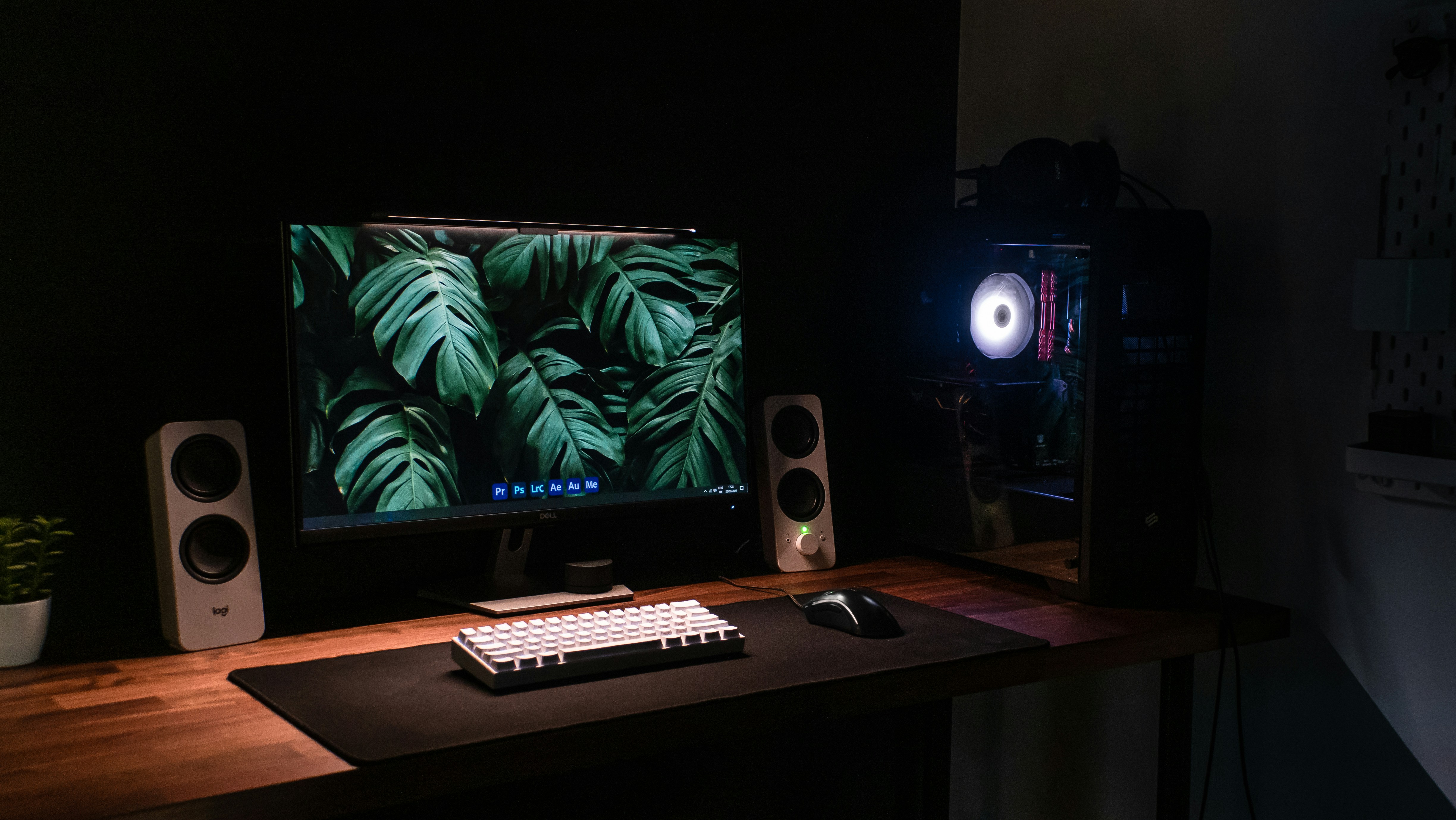 a desktop computer sitting on top of a wooden desk