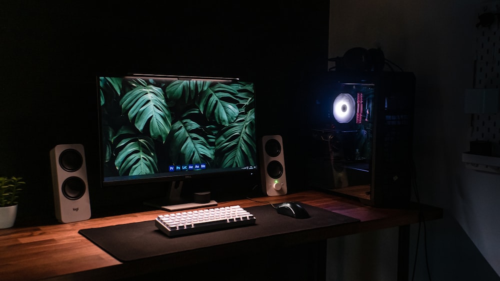 a desktop computer sitting on top of a wooden desk