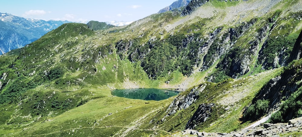 a mountain with a lake in the middle of it